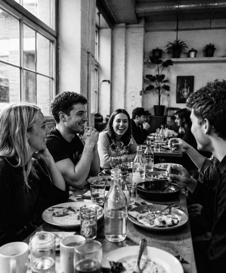 Friends at a long table sharing brunch