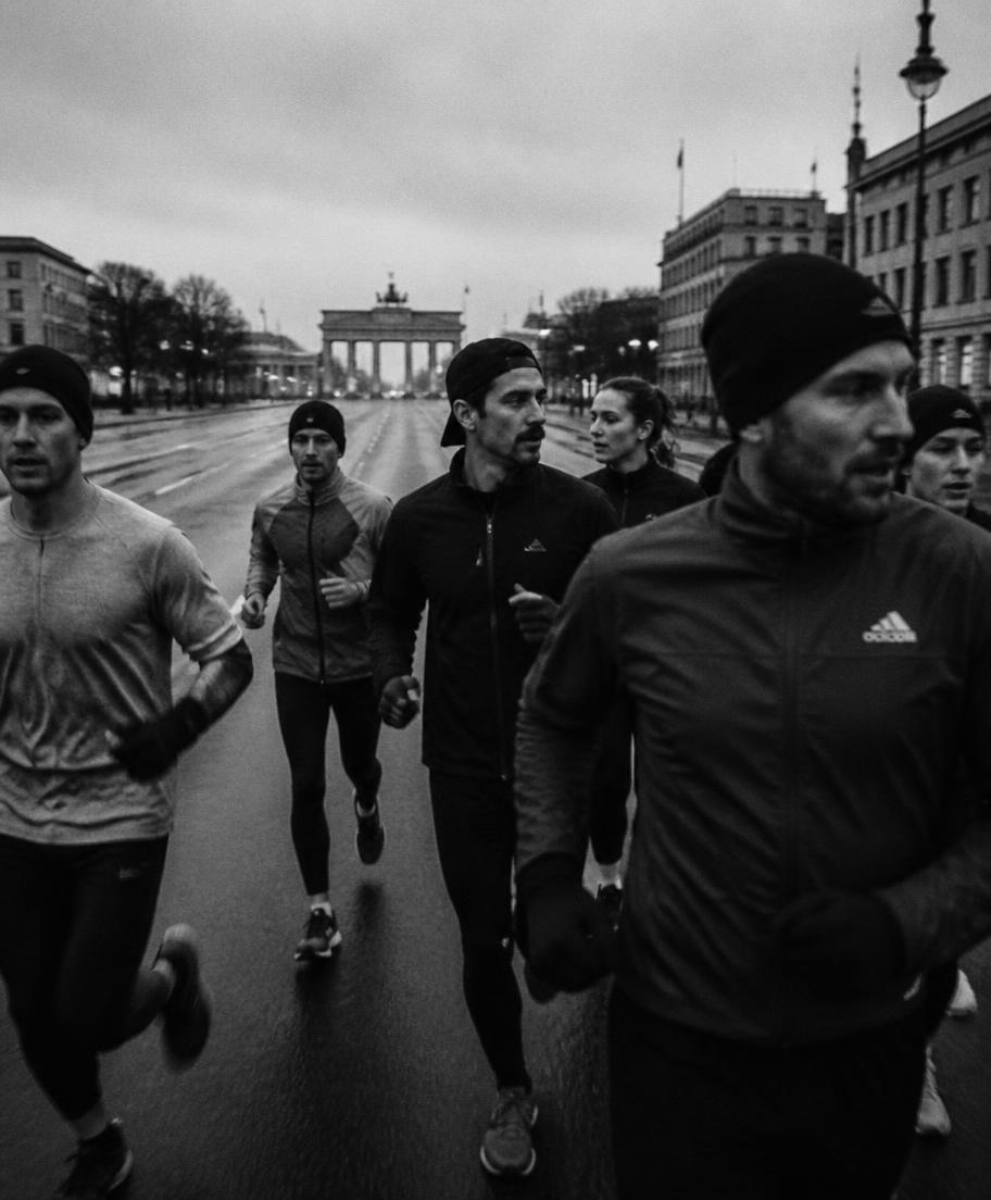 Group of runners together on an empty Berlin street